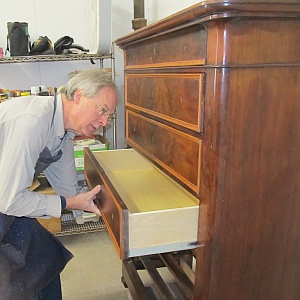 Restoration and conservation of antique wood furniture featuring veneer and marquetry